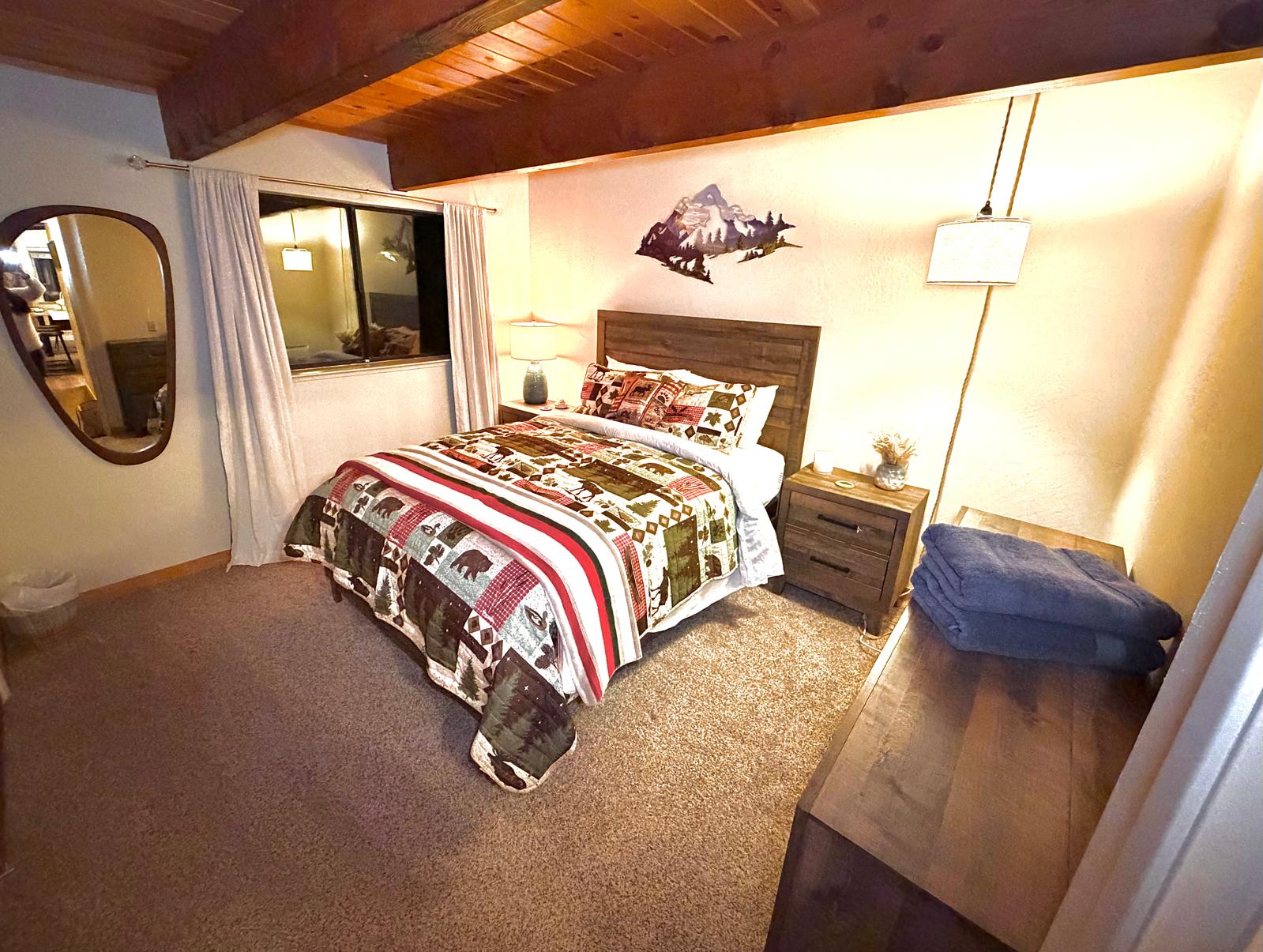 Small Bedroom with Mountain Wall Art